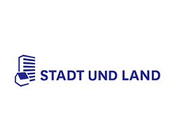 Das Logo zeigt den Schriftzug 'STADT UND LAND' in kräftigem Blau, ergänzt durch grafische Darstellungen von Häusern.